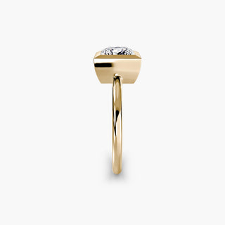 Bezel solitaire engagement ring setting in yellow gold showing the band profile, with a princess-cut lab grown diamond. || #metal_yellow gold #diamond shape_princess