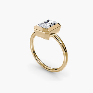 Bezel solitaire engagement ring setting in yellow gold with a radiant-cut lab grown diamond, three-quarter view. || #metal_yellow gold #diamond shape_radiant