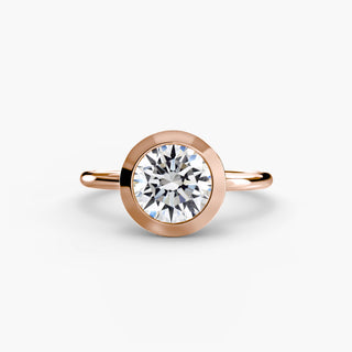 Bezel solitaire engagement ring setting in rose gold, featuring a round lab grown diamond in a smooth sculpted bezel. || #metal_rose gold #diamond shape_round