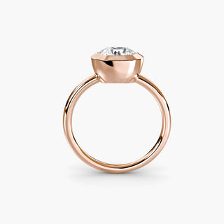 Bezel solitaire engagement ring setting in rose gold, side profile view with a round lab grown diamond. || #metal_rose gold #diamond shape_round