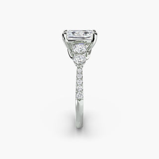 Five stone pavé trellis engagement ring setting in white gold with emerald-cut center, featuring intricate side detailing.