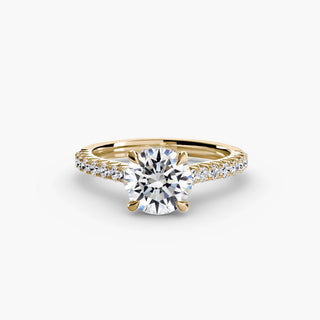 Gold lab-grown diamond engagement ring with hidden halo and pave details, featuring a cathedral setting and round center stone.