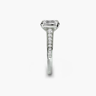 Reverse tapered channel set engagement ring with emerald-cut diamonds in white gold, showcasing side view and intricate setting details.