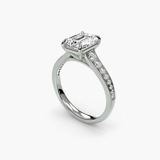 Reverse tapered channel set engagement ring with emerald-cut diamonds in white gold, featuring a sleek, modern design.
