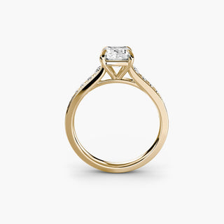 Reverse tapered channel set engagement ring with emerald-cut diamonds in yellow gold, showcasing a sleek, modern design.