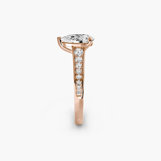 Reverse tapered channel set engagement ring with lab-grown diamonds, featuring a pear-shaped center and side stones.