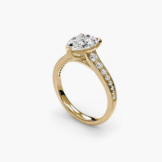Reverse tapered channel set engagement ring with pear-shaped diamonds, featuring a sleek, modern gold setting from LabGrownDiamonds.com.