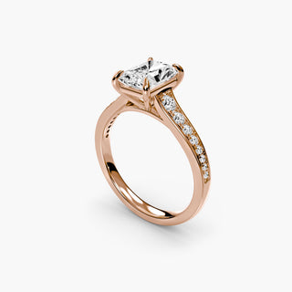 Reverse tapered channel set engagement ring with radiant cut diamonds, showcasing a sleek metal setting and detailed craftsmanship.
