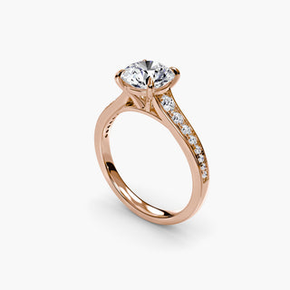 Reverse tapered channel set engagement ring with round diamonds, featuring a sleek, modern design in a four-angle view.