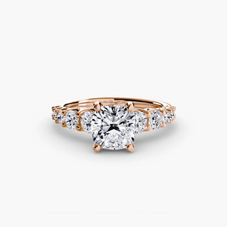 LabGrownDiamonds.com graduated round U-prong diamond band engagement ring setting with cushion-shaped main stone.