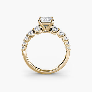 Lab-grown diamond engagement ring with graduated round U-prong diamond band, yellow gold setting, front view.