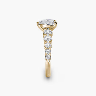 Gold graduated round U-prong diamond band engagement ring with heart-shaped accents, featuring lab-grown diamonds.