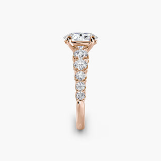 Graduated round U-prong diamond band engagement ring with oval diamonds, showcasing elegant diamond setting and craftsmanship.