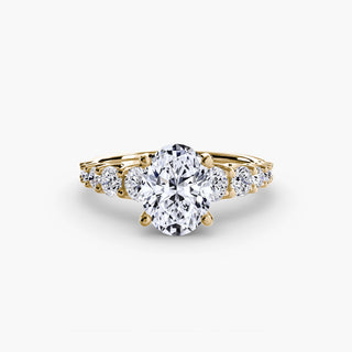 Graduated round U-prong diamond band engagement ring with yellow gold setting from LabGrownDiamonds.com, featuring oval-shaped diamonds.