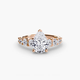 LabGrownDiamonds.com diamond engagement ring setting with graduated round U-prong band and pear-shaped diamond detail.