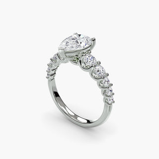 Graduated round U-prong diamond band engagement ring in white gold with multiple diamonds, shown from four angles.
