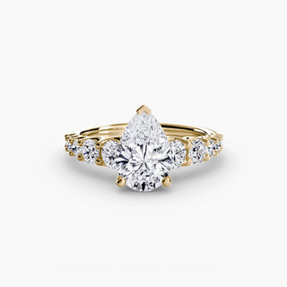 Graduated round U-prong diamond band engagement ring with yellow gold setting from LabGrownDiamonds.com, featuring multiple sparkling diamonds.