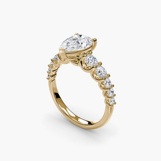 Graduated round U-prong diamond band engagement ring with yellow gold setting, featuring multiple diamonds from LabGrownDiamonds.com.