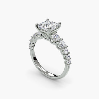 Graduated round U-prong diamond band engagement ring in white gold with four-angle view, showcasing intricate setting details.