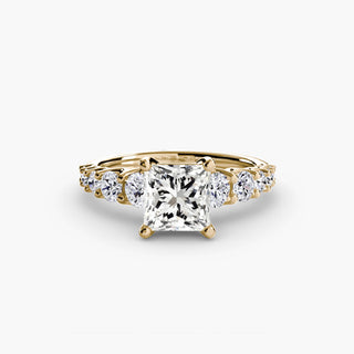 LabGrownDiamonds.com diamond engagement ring with a graduated round U-prong setting and princess-cut center stone.
