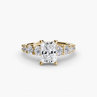 LabGrownDiamonds.com graduated round U-prong diamond band engagement ring featuring radiant-cut diamonds in gold setting.