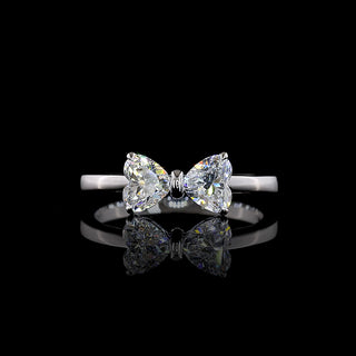 Heart-shaped bow lab grown diamond ring with 0.85 carats in white gold, showcasing intricate design and sparkling diamonds.