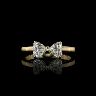 Heart-shaped bow ring with lab-grown diamonds, 0.85 carats, yellow gold band, stylish and elegant jewelry piece.