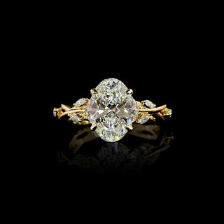 Lab Grown Diamond nature-inspired Engagement Ring with twisted vine design in yellow gold, with a 2.5 carat oval diamond center stone, approximately 3 carats total weight.