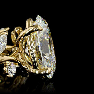 Oval lab-grown diamond engagement ring with marquise vine design in yellow gold, size 6.5, featuring 2.5 to 3 carats total weight.