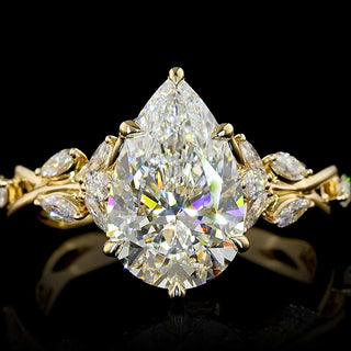 Twisted vine design pear-shaped lab-grown diamond engagement ring with yellow gold band, 2.75-3.25ct total weight.