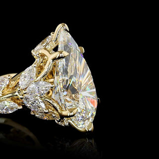 Pear-shaped lab-grown diamond engagement ring with twisted vine gold band, 2.75-3.25 carats, yellow gold.