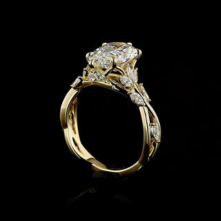 Yellow gold engagement ring with twisted vine design and pear-shaped lab-grown diamond, 2.75-3.25 carats total weight.