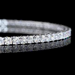 Round lab-grown diamond tennis bracelet with 3 carats total weight, 7-inch white gold band, featuring sparkling 4-point diamonds.