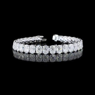 Cushion-shaped lab-grown diamond tennis bracelet with 32 carats total weight in white gold, featuring sparkling diamonds.