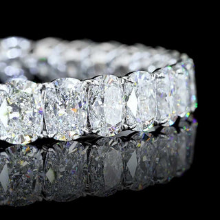 Cushion cut lab-grown diamond tennis bracelet with 32 total carats in white gold setting, showcasing sparkling diamonds.