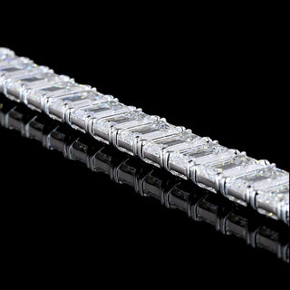 Emerald lab-grown diamond tennis bracelet with 35 carats total weight in white gold, 7-inch length, featuring sparkling emerald cut stones.