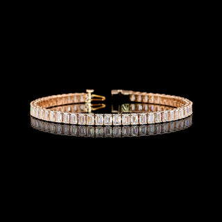 Emerald lab-grown diamond tennis bracelet with 10 carats total weight, 7-inch rose gold setting, showcasing sparkling emerald cut stones.