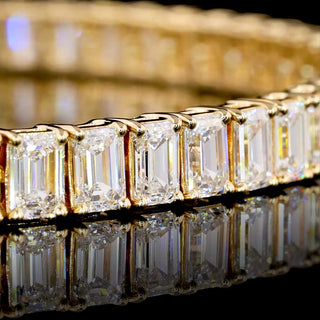 14K yellow gold lab-grown emerald diamond tennis bracelet with 10 carats total weight and 17-point stones, 7-inch length.