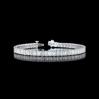 Emerald lab-grown diamond tennis bracelet with 12 carats total weight, set in white gold, featuring 22-point emerald-cut diamonds.