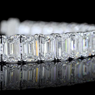 Emerald lab-grown diamond tennis bracelet with 24 carats total weight, 42 emerald-cut stones, 7-inch white gold bracelet.
