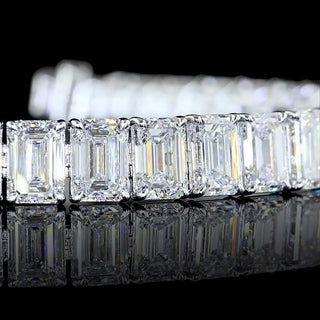 Emerald lab-grown diamond tennis bracelet with 26 carats total weight, 39 emerald-cut stones on a 7-inch white gold band