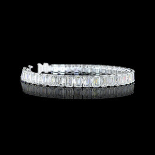Emerald lab-grown diamond tennis bracelet with 26 carats total weight, 39 emerald cut stones, 7-inch white gold setting.