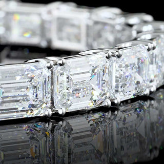East-West style emerald lab-grown diamond tennis bracelet with 24.55 carats total weight, 7-inch white gold setting.