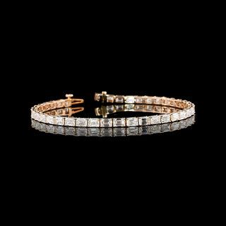Emerald lab-grown diamond tennis bracelet with east-west design, 8 carats total weight, 7-inch rose gold setting.