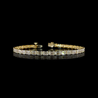 East-West Emerald-cut lab grown diamond tennis bracelet in 14k yellow gold, prong setting, 10 carats total.