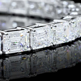 East-West emerald lab-grown diamond tennis bracelet with 10 carats total weight, set in white gold, 7-inch length.