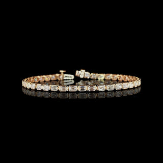 East-West Emerald-cut lab grown diamond tennis bracelet in 14k rose gold, bezel setting, 5 carats total.