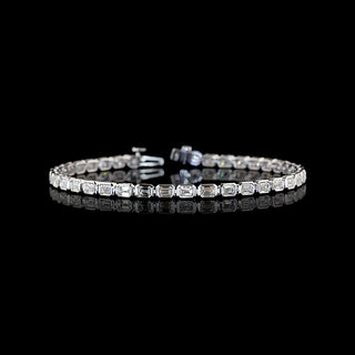 East-West Emerald-cut lab grown diamond tennis bracelet in 14k white gold, bezel setting, 5 carats total.