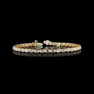 East-West Emerald-cut lab grown diamond tennis bracelet in 14k yellow gold, bezel setting, 5 carats total.