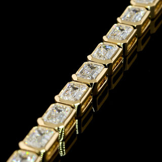 Lab Grown Diamonds 7 CTW emerald bezel tennis bracelet with lab-grown diamonds on yellow gold, 7-inch length, east-west setting.